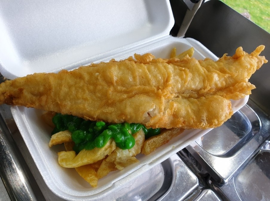 Freshly cooked fish and chips served for wedding catering